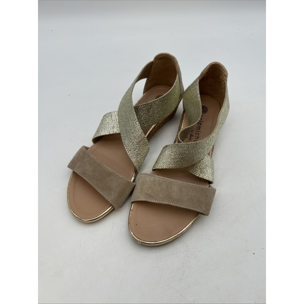 pair of handmade gold and tan sandals from the brand Eric Michael